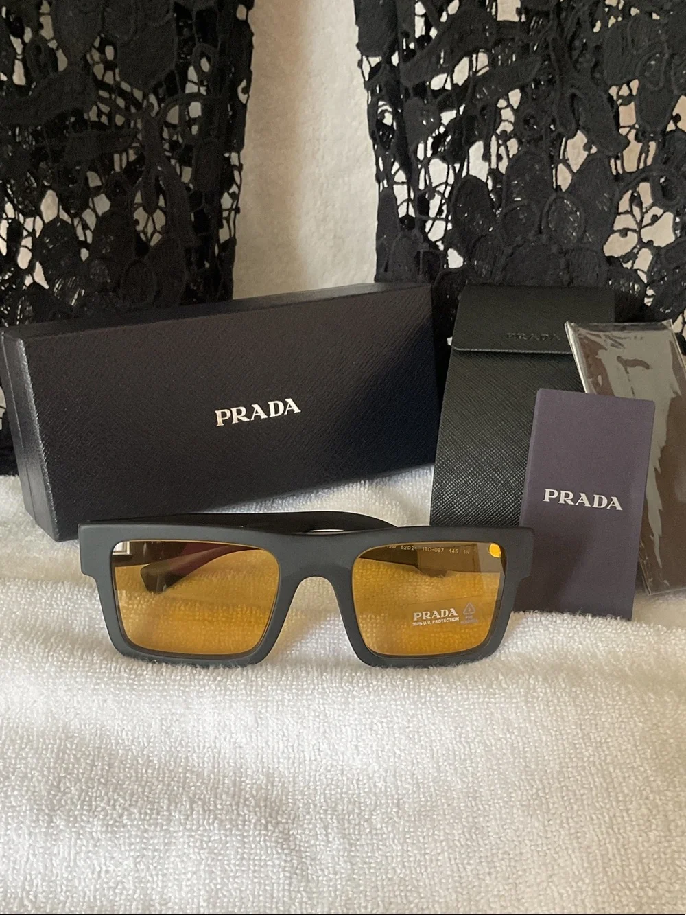 Prada Matte Black Rectangular Sunglasses with Amber Lenses